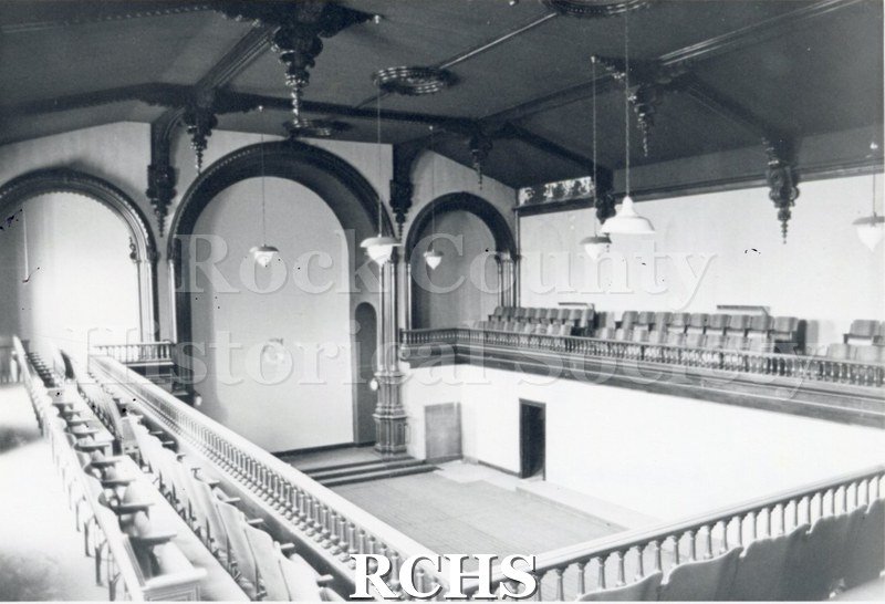 Black and white photograph of Court Street Methodist Church. Shows the inside of a church showing a balcony with seats on the three sides.