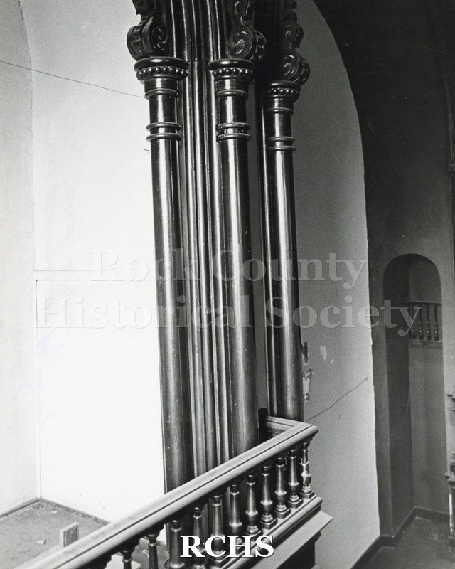 Black and white photograph of the Court Street Methodist Church. Shows a pillar holding up the balcony.