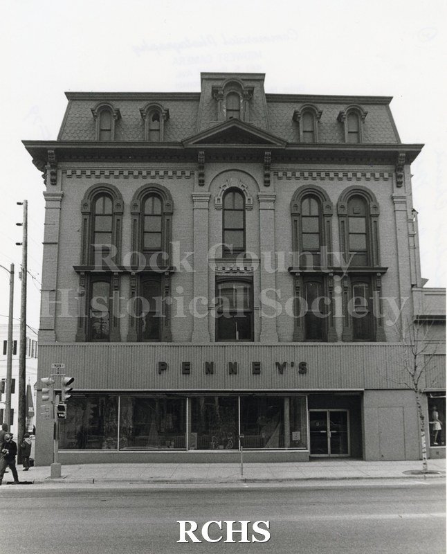 Black and white photograph of the Court Street Methodist Church with Penney's Facade. Shows the outside of a four story building with arched windows.