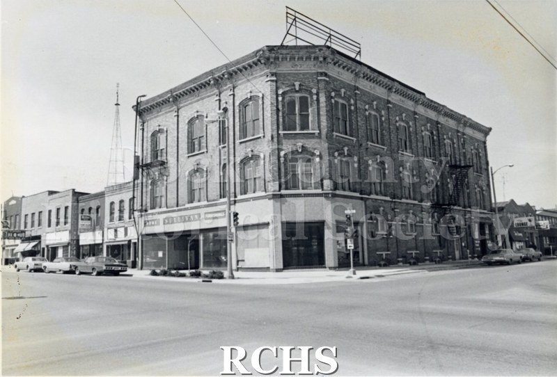 Black and white photograph of Myers Block-Old Armory, Janesville, WI. Shows a three story building on a corner. Sign on the front reads: "Sullivan".