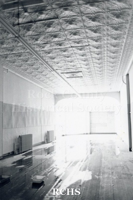 Black and white photograph of Myers Block-Old Armory, Janesville, WI, interior view, showing the ceiling in detail.