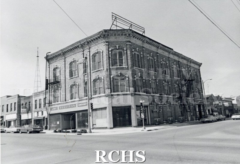 Black and white photograph of Myers Block-Old Armory, Janesville, WI, exterior view, showing a three story building with "Sullivan" sign on it.