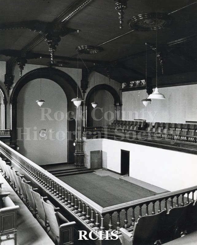Black and white photograph of Court Street Methodist Church. Shows the inside of a church with a balcony with seats on the three sides.