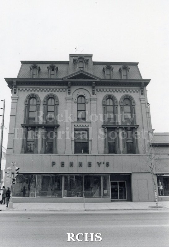 Black and white photograph of the Court Street Methodist Church. Shows a three story building, front view, with Penney's sign over the first floor.