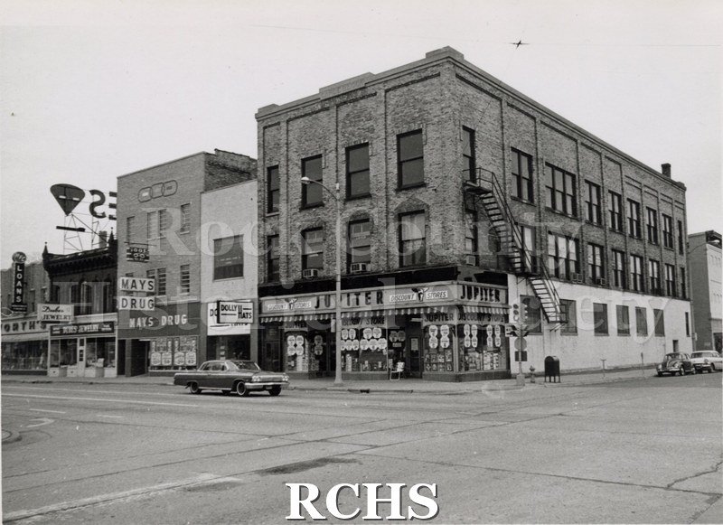 Black and white photograph of the SE Corner W. Milwaukee/River.