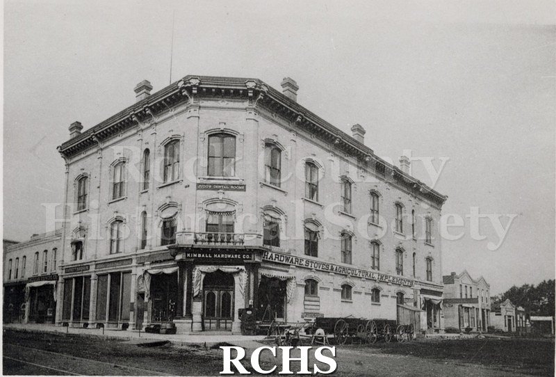Black and white photograph of Kimball Hardware Co., Janesville, WI, a three story building on a corner.