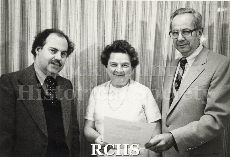 Black and white photograph of Richard Hartung, Marjorie Kroehler and Richard Erney holding a certificate.