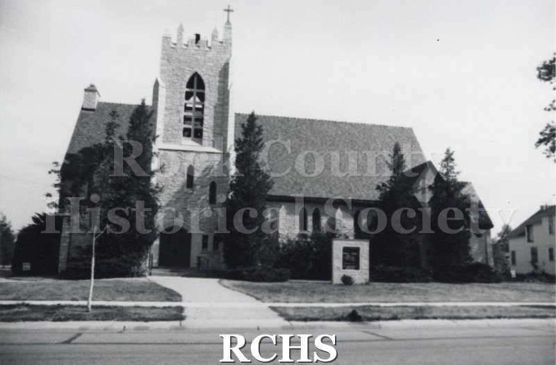 Black and white photograph of the Milton 7th Day Baptist Church, a brick church with a bell tower.