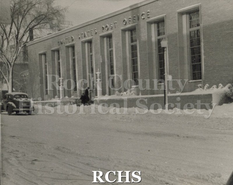 Black and white photograph of the United States Post Office, a one story building on Dodge Street.
