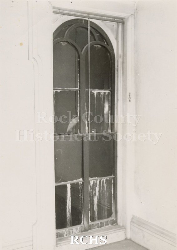 Black and white photograph of the arched "Signal" window on the second floor of the Tallman House.