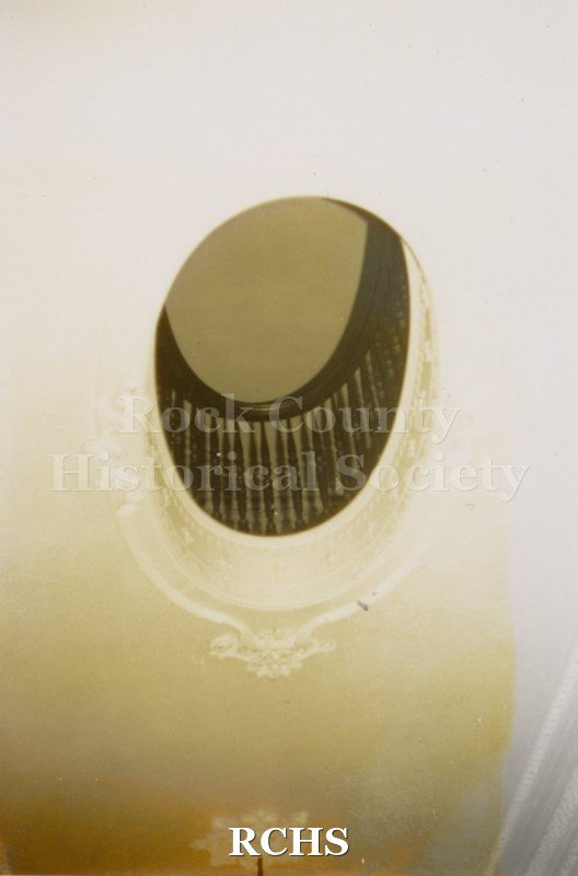 Color photo of the oval opening on the stairway in the Tallman House.