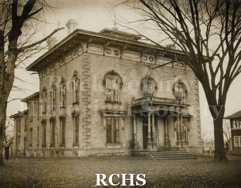 Historic image of Brownish potograph of the Tallman House. Shows bare trees around the house.