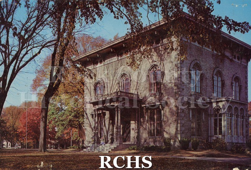 Postcard. color photo of the Tallman House from the front and north side.