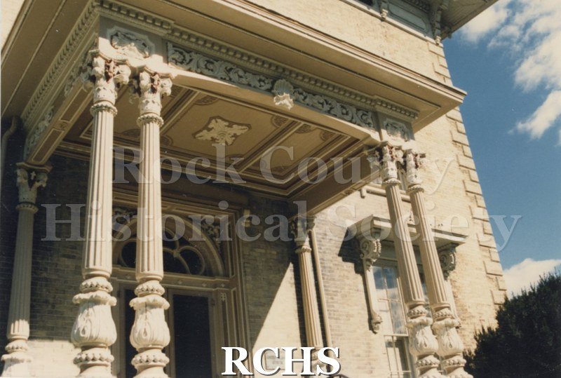 Color photo of the Tallman House front porch.