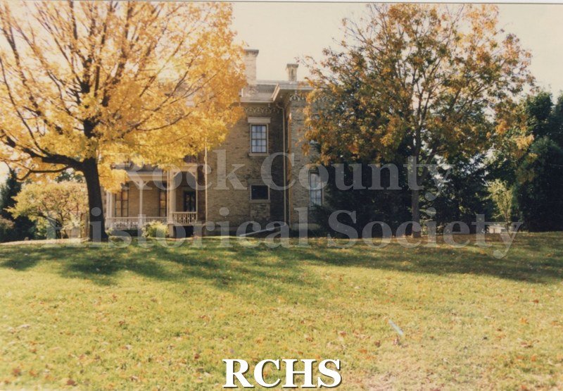 Color photo of the Tallman House from the side.