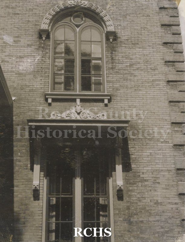 Black and white photograph of the windows in the Tallman House.