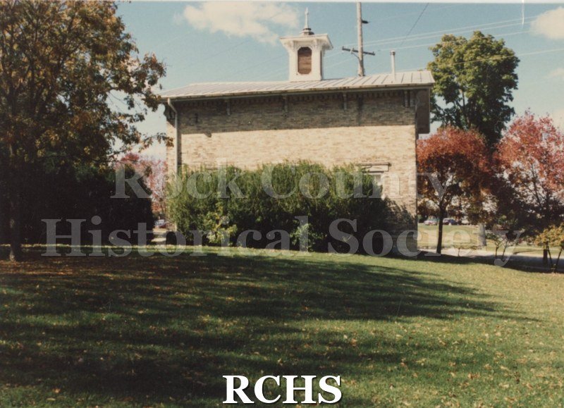 Color photo of the Carriage House from the back.