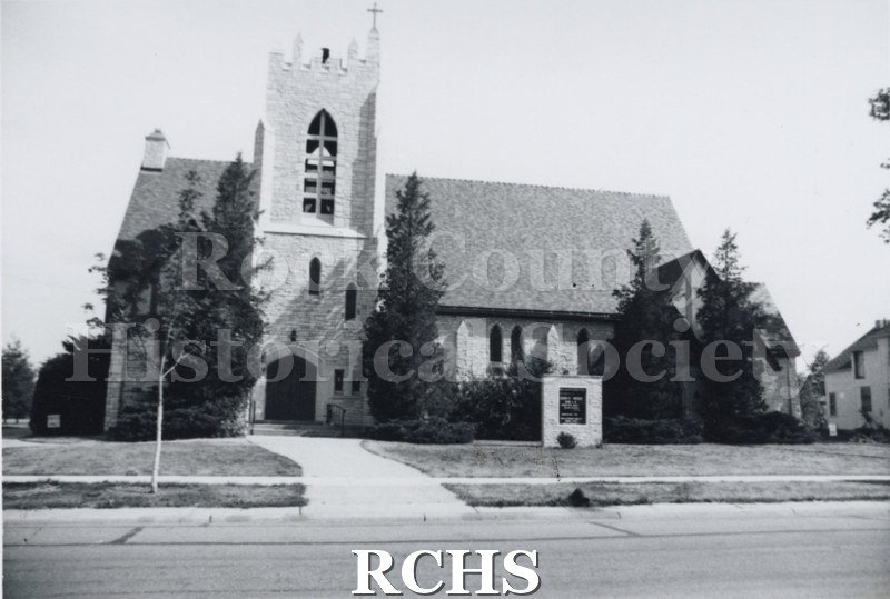 Black and white photograph of the Milton 7th Day Baptist Church, a brick church with a bell tower.