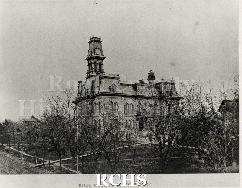 Black and white photograph of the Rock County Court House with its tower.