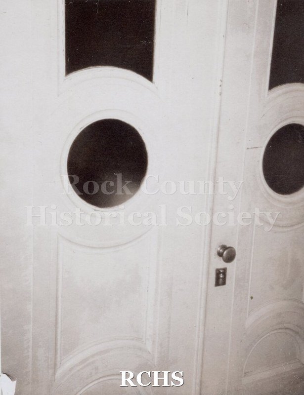 Black and white photograph of the doors leading to main hall in Tallman House.