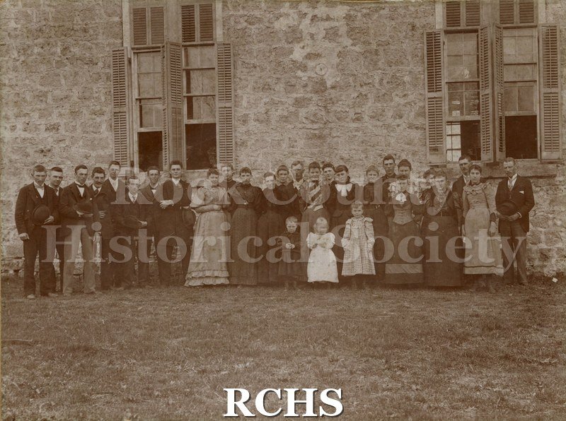 Black and white photograph of Shopiere Congregational Church 1894. A large group of people is standing in front of a church.