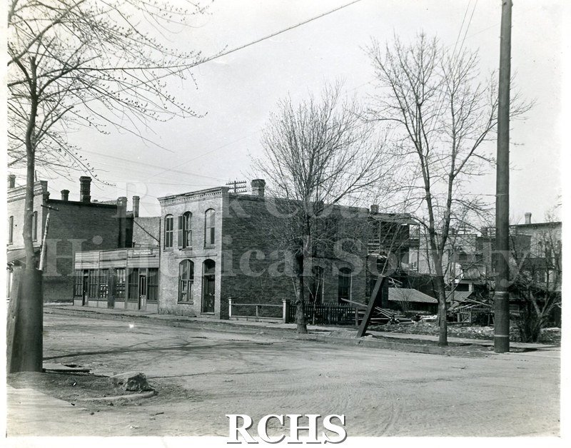 Black and white photograph of the N. E. Corner of Dodge and Franklin. Shows several buildings.