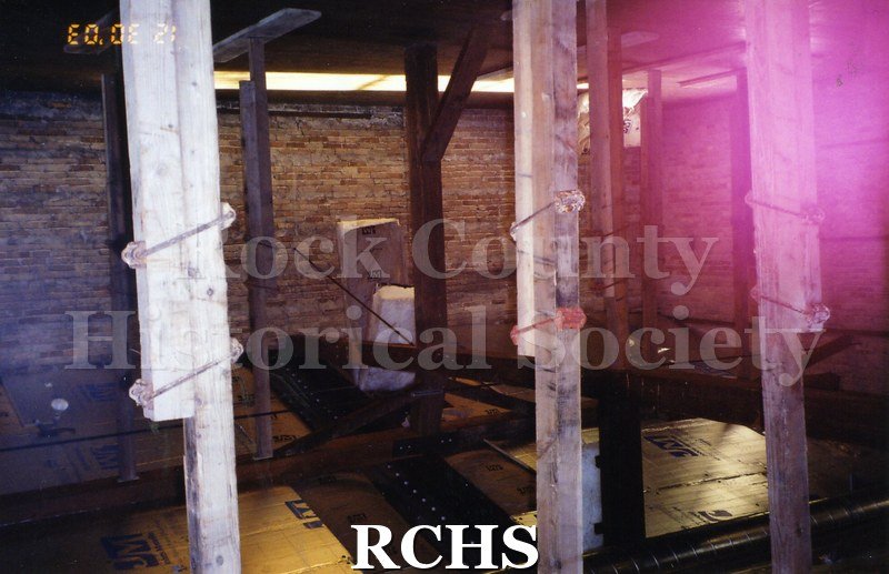 Color photo of the interior of the Carriage House with construction work being done.