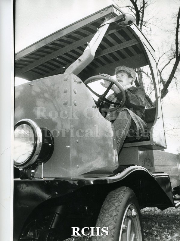 Black and white photograph of Dudley Kimball sitting in the cab of the Samson truck. Shows the license number 512-703 Penna 1922.