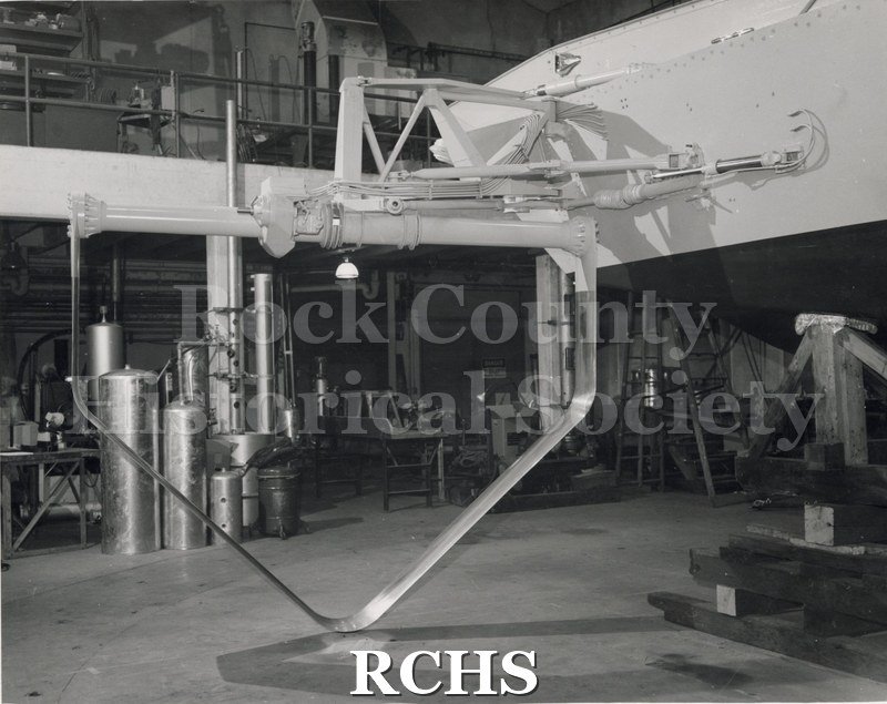 Black and white photograph of the "High Lander" hydrofoil inside a factory.