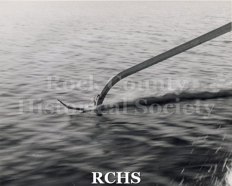 Black and white photograph of a close-up of ski only. Photographer: "Black Photo Service 305 University Ave. Madison, Wisconsin Commercial Photography.