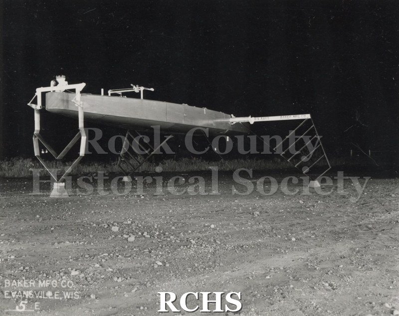 Black and white photograph of the Monitor Hydrofoil without sail; foils down from the front. On bottom: Baker Mfg. Co. Evansville, Wis 3E" Photographer: H. C.
