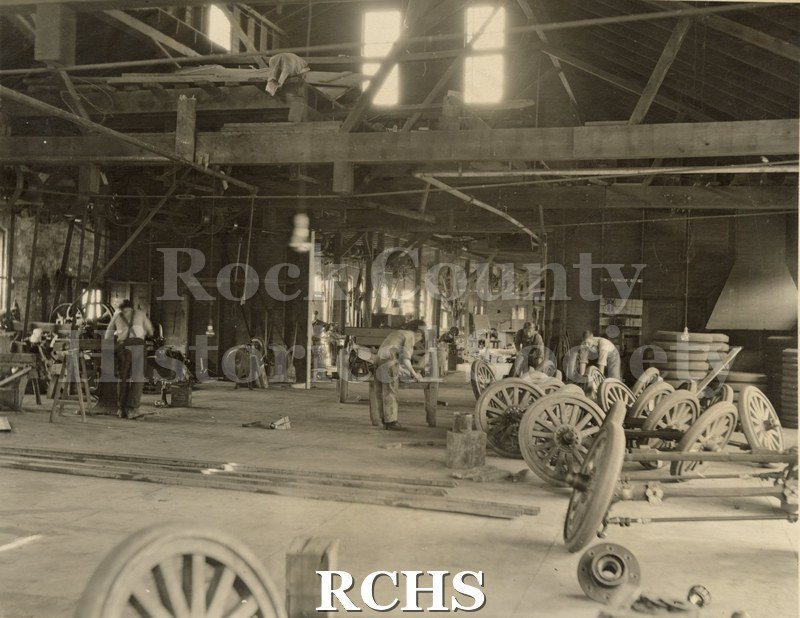 Black and white photograph of factory workers from Highway Trailer Co., Edgerton, WI.