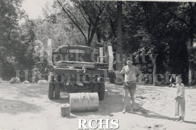 TPhotograph. Black and white photograph of a truck with part of the hydrofoil on it.