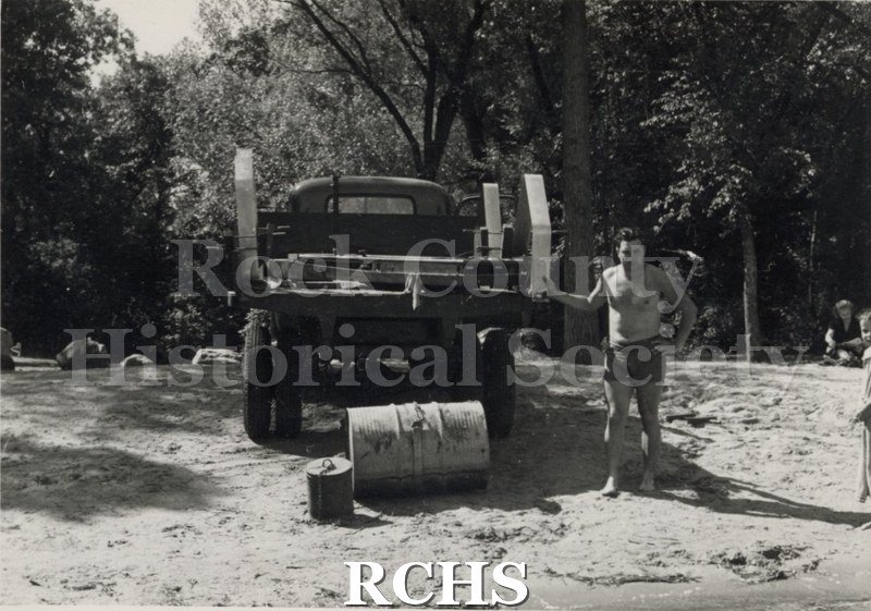 Black and white photograph of a truck with part of the hydrofoil on it.
