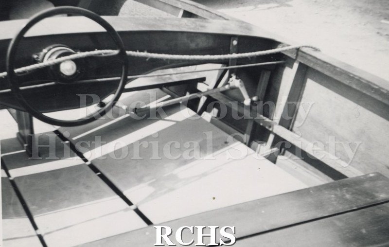 Black and white photograph of "Sea Flyer"-Hydrofoil-Central interior view with a steering wheel visible. Description reads: "The Sea Flyer-Hydrofoil-Baker Mfg.