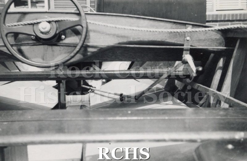 Black and white photograph of The "Sea Flyer"-Hydrofoil-Central interior view with a steering wheel visible. Description reads: "The "Sea Flyer"-Hydrofoil-Baker Mfg.
