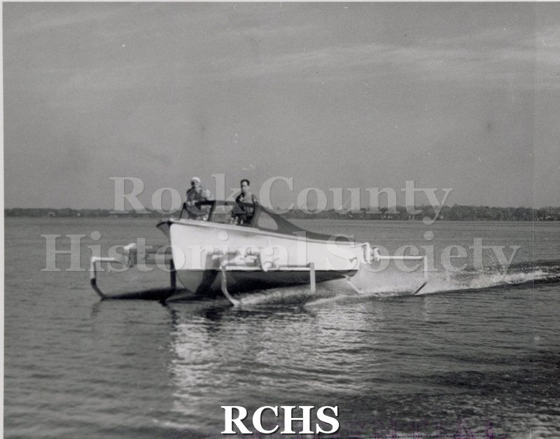 Black and white photograph of "High Pockets" with two men standing in the front. On bottom: "Confidential".