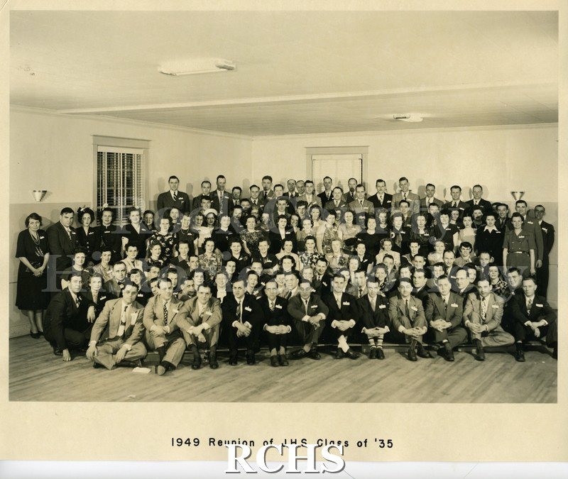 Black and white photograph of the 1949 reunion of Janesville High School Class of 1935. Included in envelope is information on classmates.