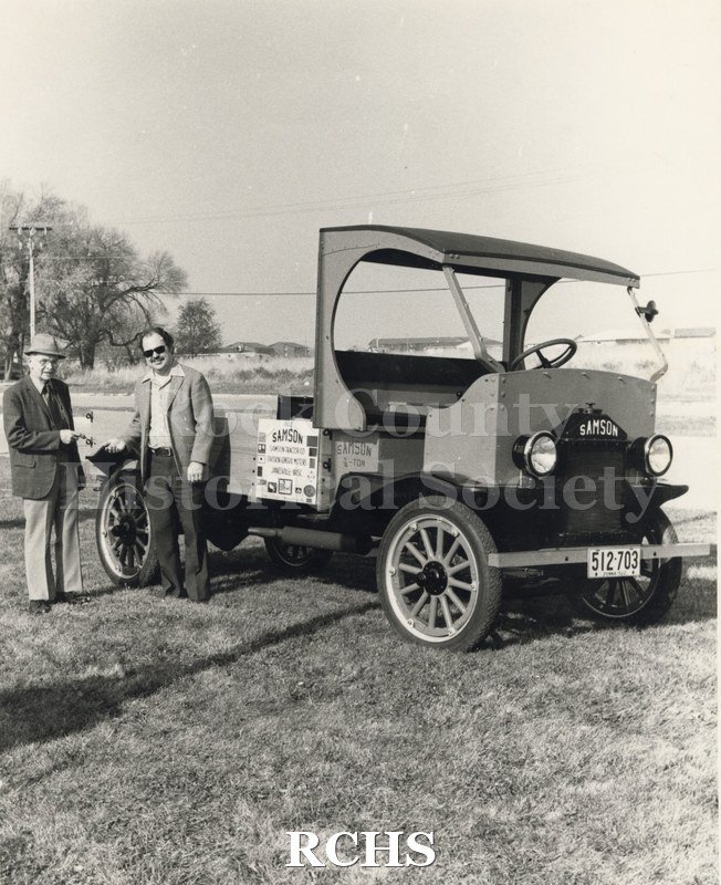 Black and white photograph of Ernest G. Staley and Richard P. Hartung standing beside the Samson Truck with license 512 703.