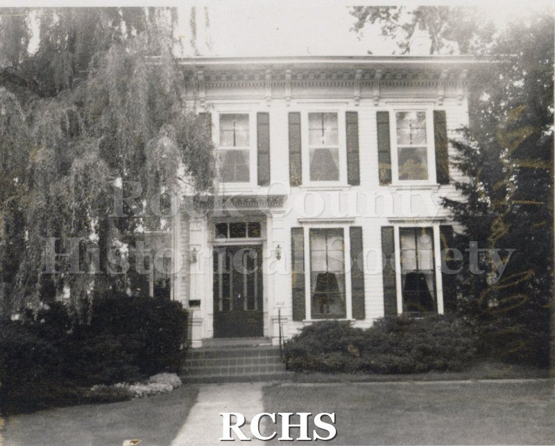 Black and white photograph of Paul Williams' home, a two story white house with three windows on the second floor and two beside the door on the first floor.
