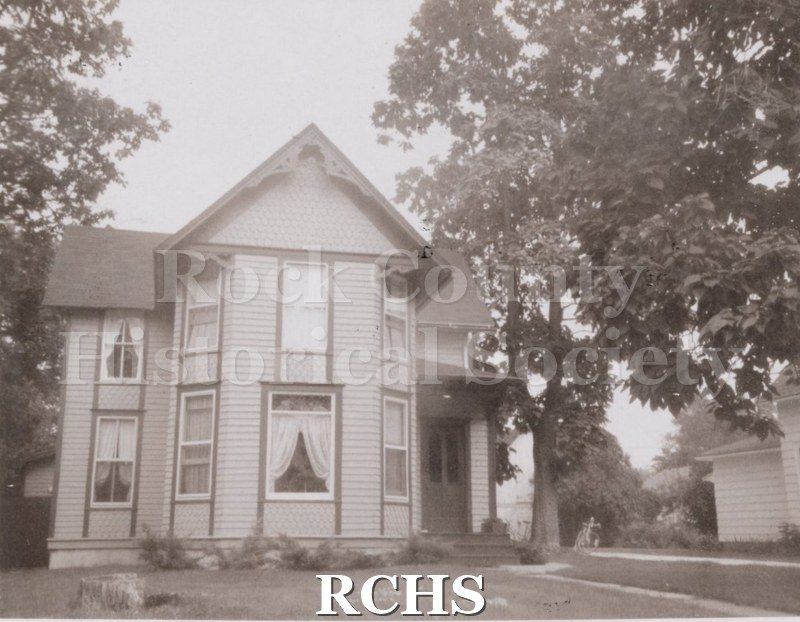 Black and white photograph of a two story house with attic peak at 445 Forest Park Blvd.