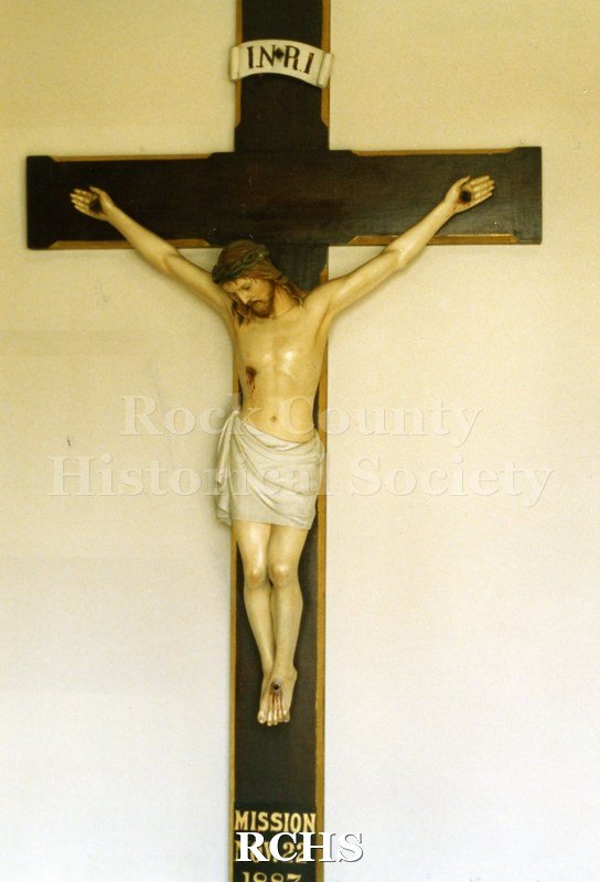 Historic image of Color photogrpah of St. Patrick's Catholic Church, Janesville, WI, showing the crucifix above the altar.