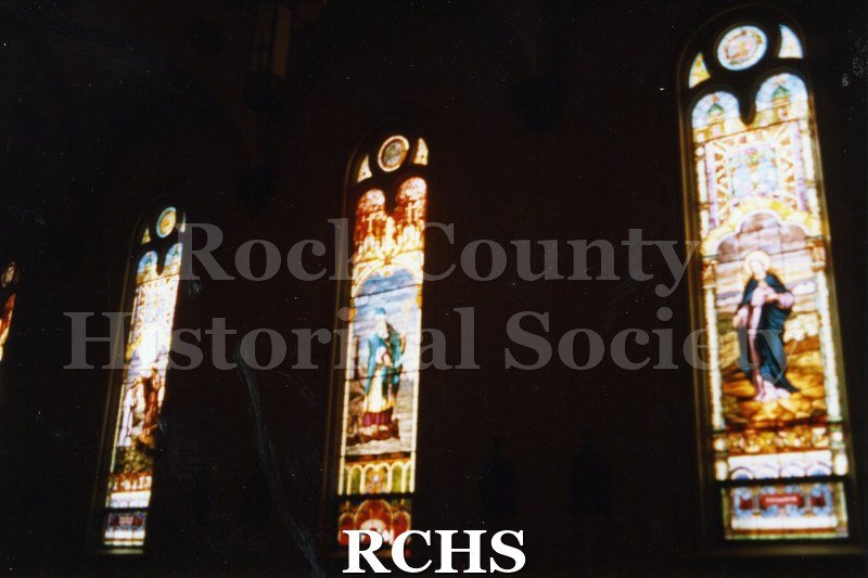 Color photo of three stained glass windows in St. Patrick's Catholic Church, Janesville, WI.