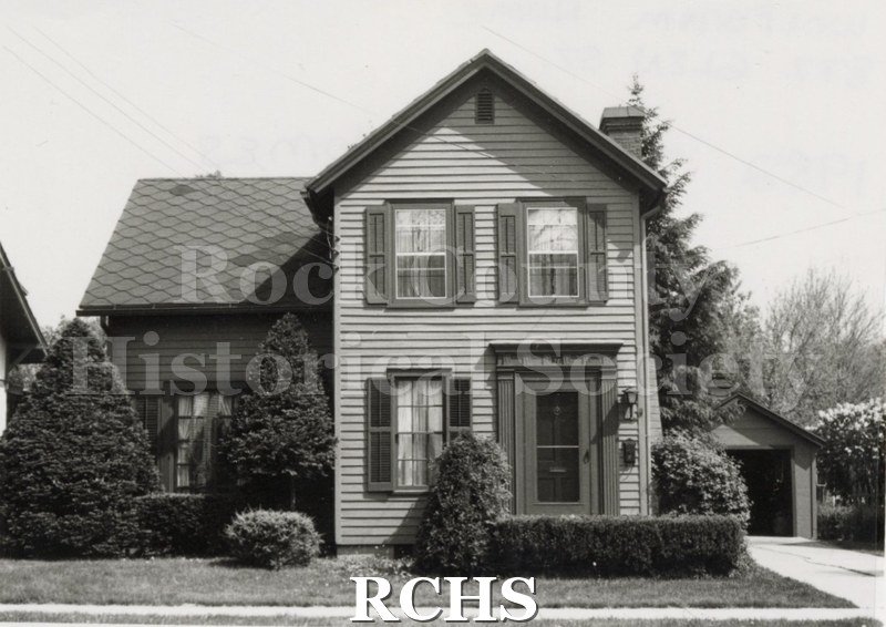 Black and white photograph of Cindy Simpson's home on Wisconsin Street, a two story house with a one story ell on the left.