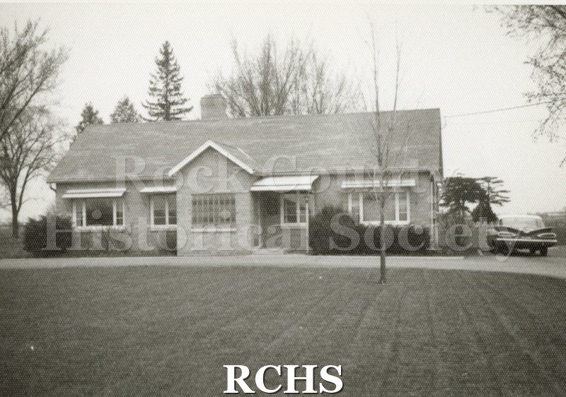 Black and white photograph of Damrow Chiropractic Office. Shows the building in the background.