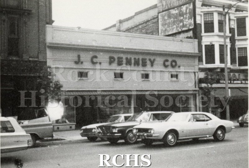 Black and white photograph of J. C. Penney Co. building on Main Street in Janesville, WI.