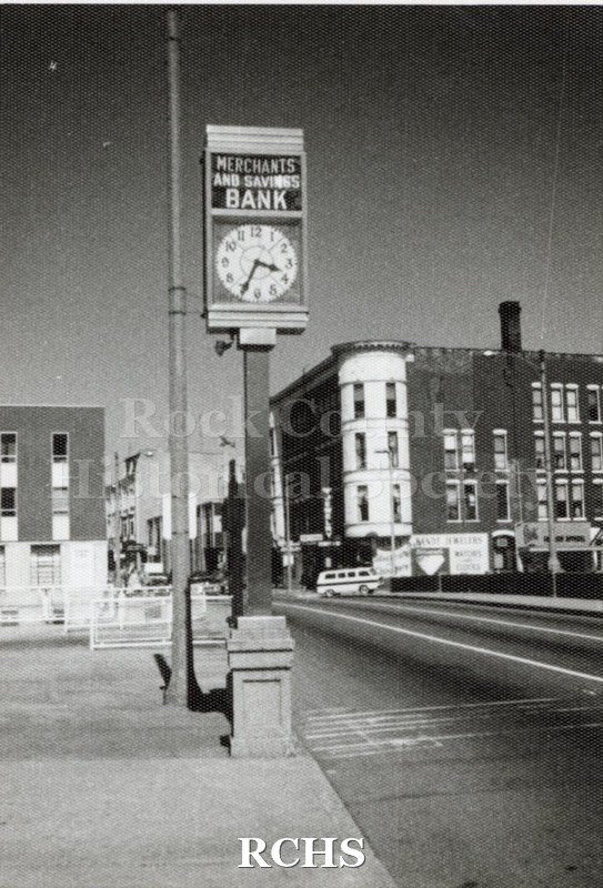 Black and white photograph of the Hayes Building, Janesville, WI, on the corner of Main and Milwaukee Streets, Janesville, WI.