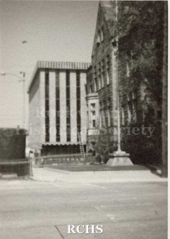 Black and white photograph of the Janesville Municipal building, showing the addition.