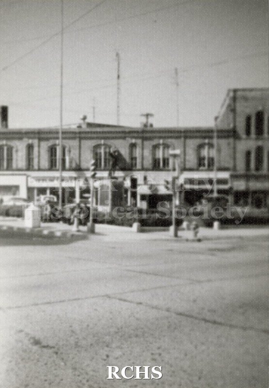 Black and white photograph of Corn Exchange with buildings in the background.