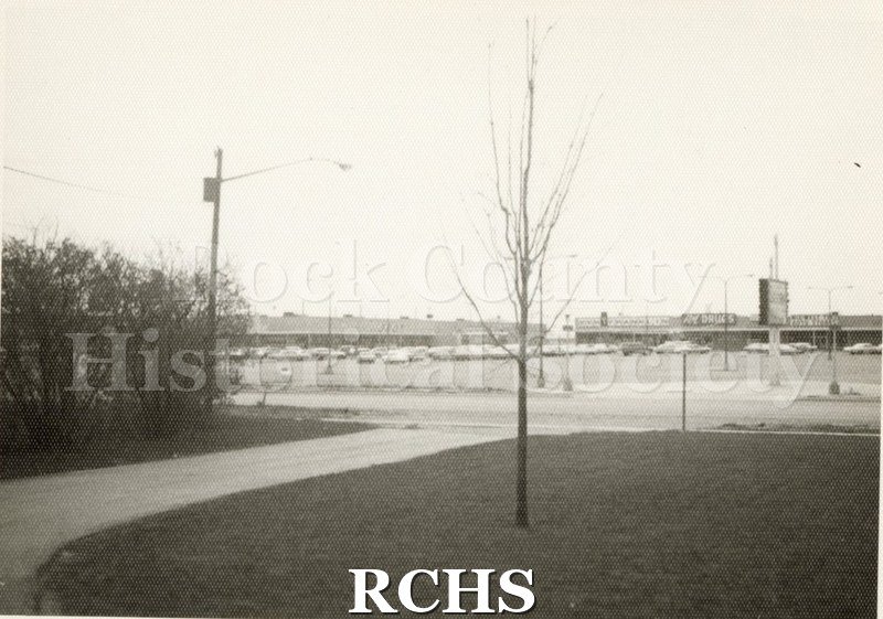 Black and white photograph of the Blackhawk Shopping Center, Janesville, WI, from a distance.